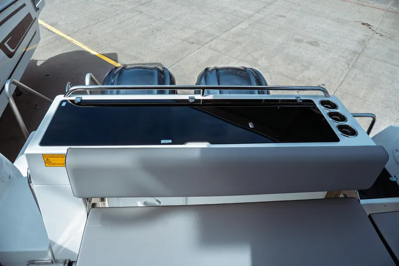 Slide: The Image of 2025 Jeanneau NC 895 Sport Series 2 boat deck with dual engines and sleek design. - 11