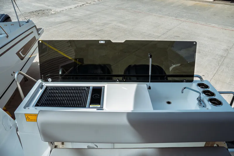 Slide: The Image of Outdoor kitchen on Jeanneau NC 895 Sport Series 2, 2025 model, featuring grill and sink. - 13