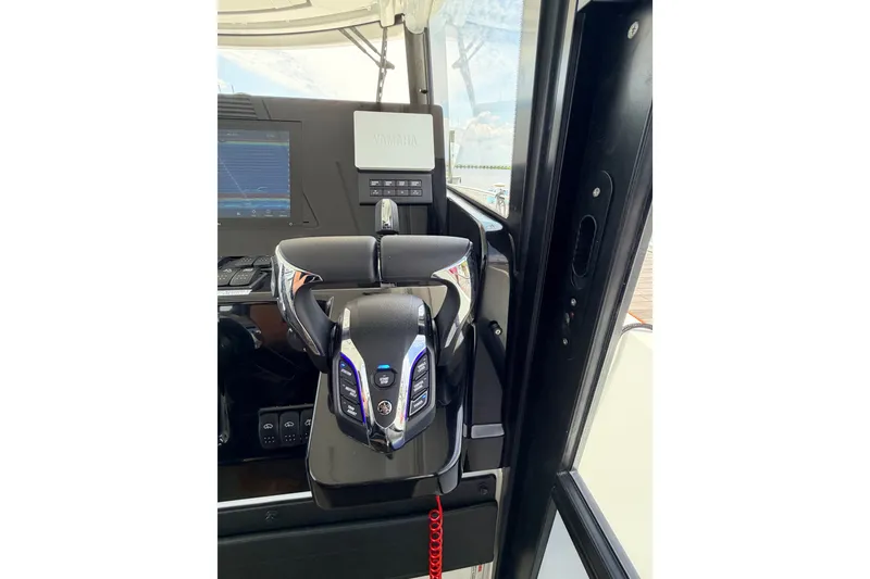Slide: The Image of Helm of 2026 Jeanneau NC 895 Sport Series 2 with advanced controls and navigation display. - 37