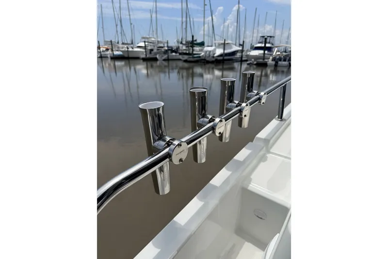 Slide: The Image of Stainless steel rod holders on Jeanneau NC 895 Sport Series 2, 2026 model, docked at marina. - 23