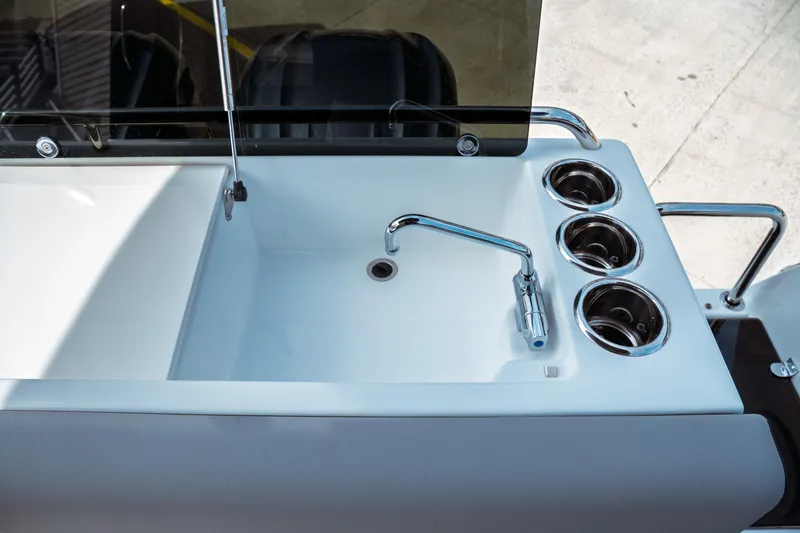 Slide: The Image of 2025 Jeanneau NC 895 Sport Series 2 boat sink and cup holders detail. - 15