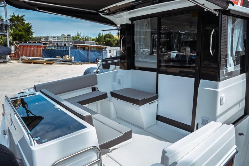 Slide: The Image of 2025 Jeanneau NC 895 Sport Series 2 boat with sleek seating and modern design. - 9