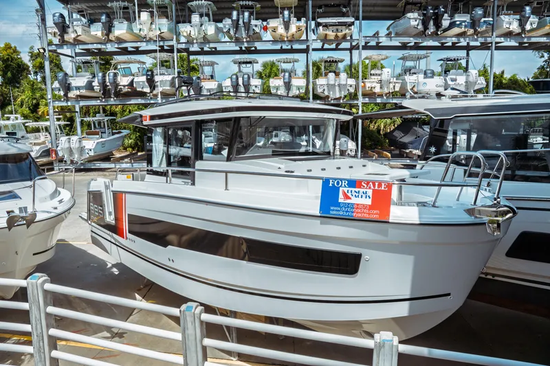 Slide: The Image of 2025 Jeanneau NC 895 Sport Series 2 boat for sale at a marina. - 7