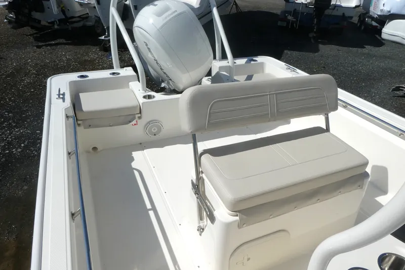Slide: The Image of 2027 Boston Whaler 190 Montauk boat interior with seating and motor. - 6
