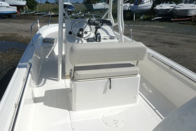 Slide: The Image of 2027 Boston Whaler 190 Montauk boat interior with steering console and seating. - 5