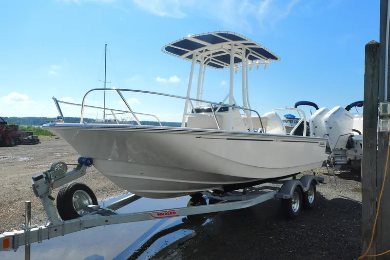 Slide: The Image of 2027 Boston Whaler 190 Montauk boat on trailer under clear blue sky. - 3