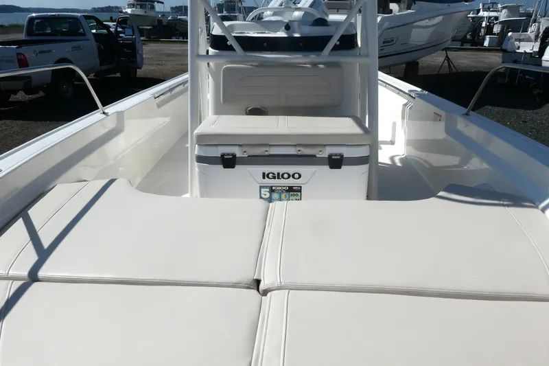 Slide: The Image of 2027 Boston Whaler 190 Montauk boat interior with Igloo cooler and cushioned seating. - 9