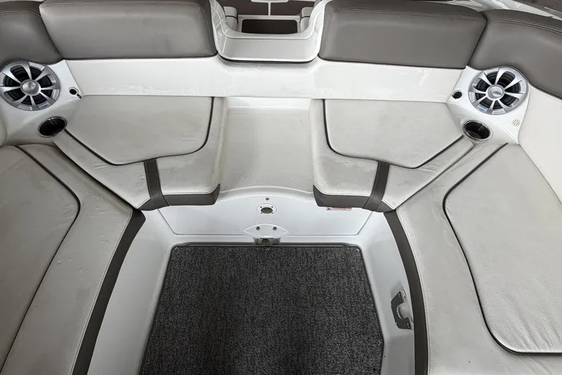 Slide: The Image of Interior seating of a 2012 Yamaha 242 Limited S boat with speakers and cup holders. - 6