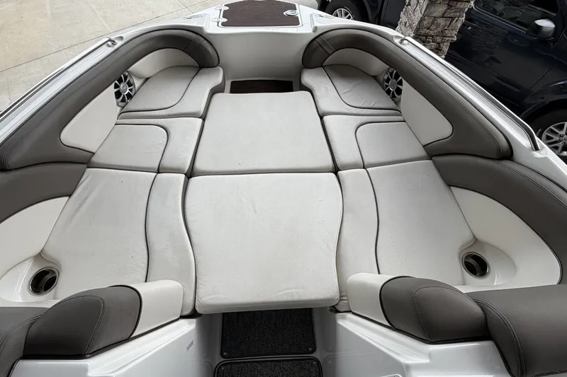 Slide: The Image of Interior seating of a 2012 Yamaha Boats 242 Limited S, featuring cushioned layout. - 10