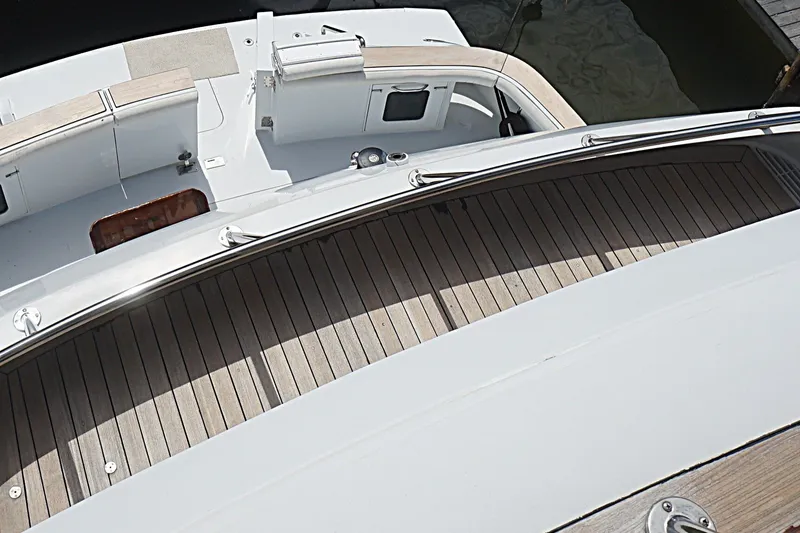 Slide: The Image of 1996 Hatteras yacht deck with wood finish and sleek design. - 32