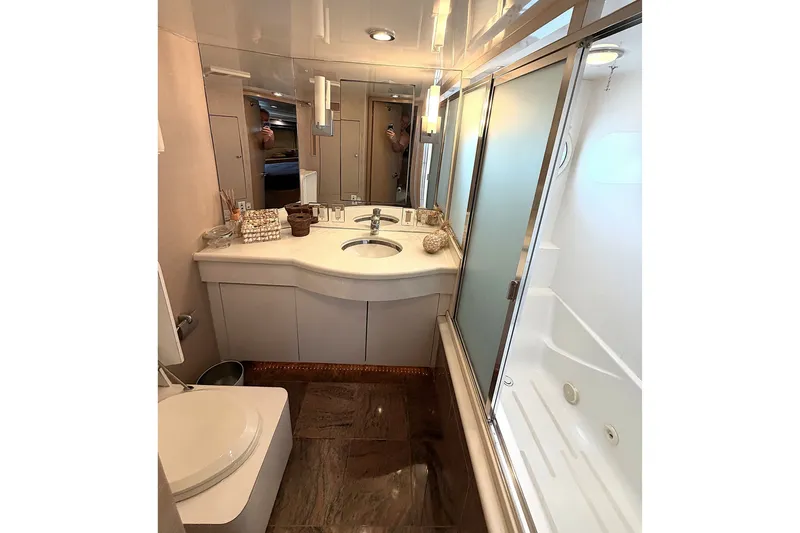 Slide: The Image of Luxurious 1996 Hatteras yacht bathroom with modern fixtures and elegant design. - 14