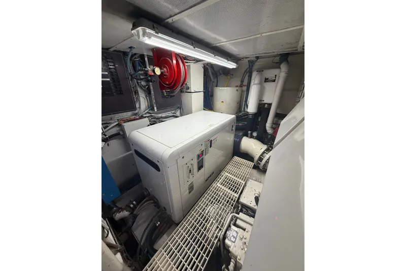 Slide: The Image of Engine room of a 1996 Hatteras boat with machinery and equipment. - 39