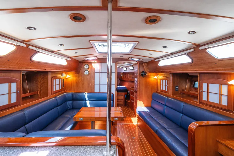 Slide: The Image of Luxurious interior of 2013 Sabre 456 yacht with wooden finish and blue seating. - 4