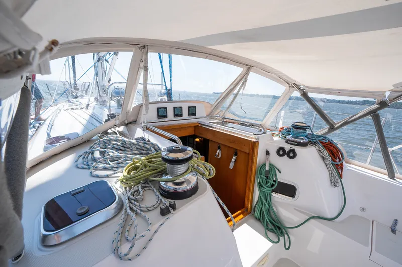 Slide: The Image of Cockpit of 2013 Sabre 456 sailboat with ropes and winches on a sunny day. - 45