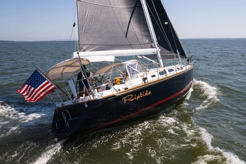 Slide: The Image of Sailing yacht "Riptide" on open water, Sabre 456, 2013 model, with American flag. - 33