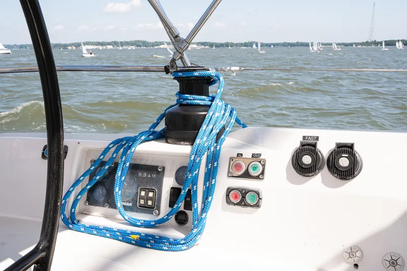 Slide: The Image of Control panel of a 2013 Sabre 456 sailboat with blue ropes and lake view. - 61