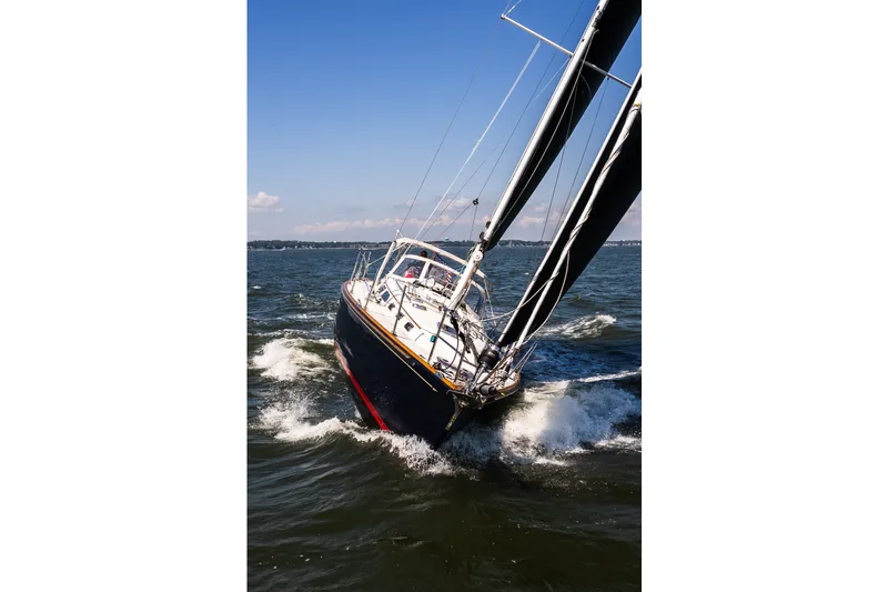 Slide: The Image of Sailing yacht Sabre 456 (2013) navigating through waves on a sunny day. - 52