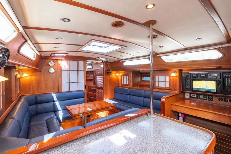 Slide: The Image of Luxurious interior of 2013 Sabre 456 yacht with wood finish and navigation equipment. - 10