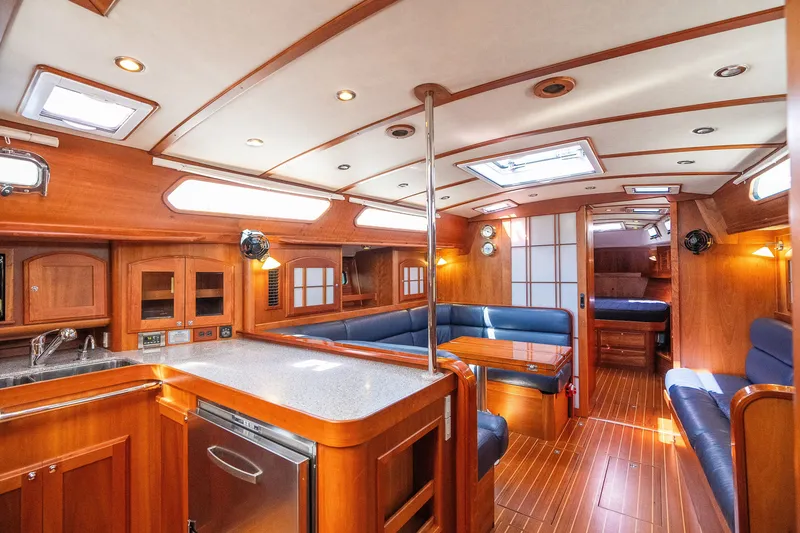 Slide: The Image of Luxurious interior of 2013 Sabre 456 yacht with wood finish and blue seating. - 5
