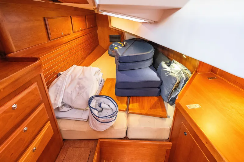 Slide: The Image of Cozy cabin interior of 2013 Sabre 456 yacht with wooden furnishings and cushions. - 30
