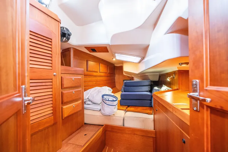 Slide: The Image of Interior of 2013 Sabre 456 yacht with wooden cabinetry and seating area. - 29