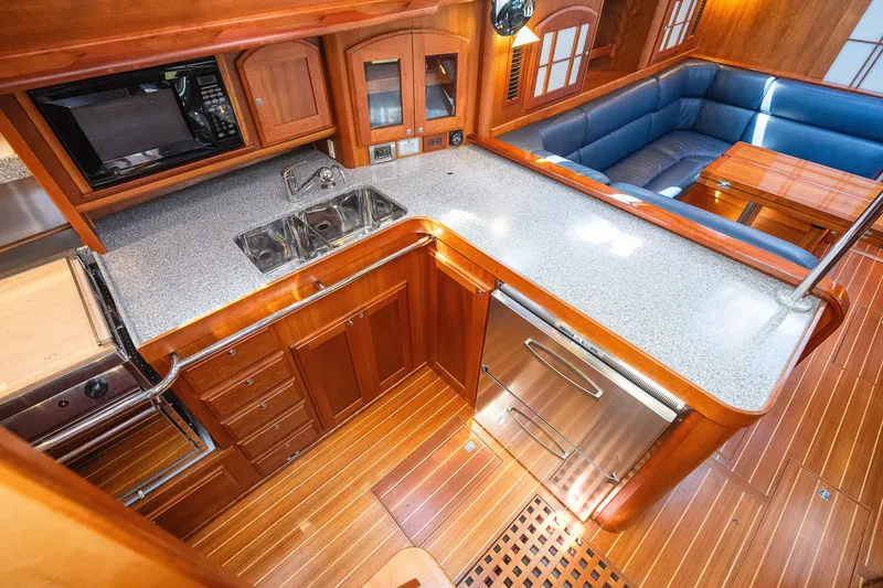 Slide: The Image of Luxurious Sabre 456 yacht interior with modern kitchen and cozy seating area, 2013 model. - 9
