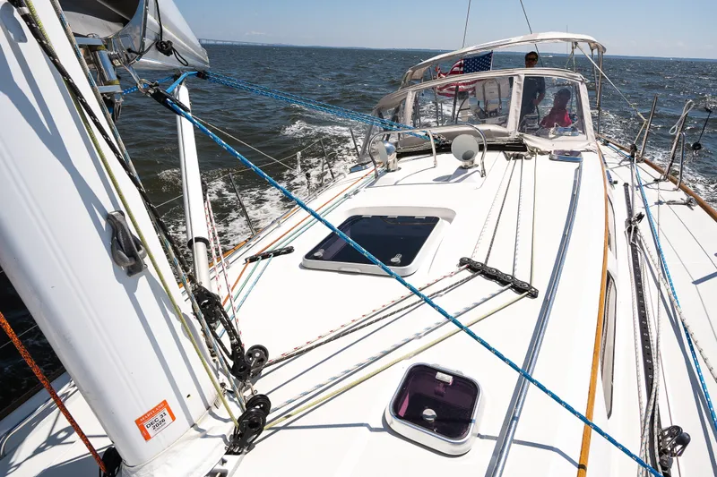 Slide: The Image of Sailing on a 2013 Sabre 456 yacht, navigating open waters under clear skies. - 36