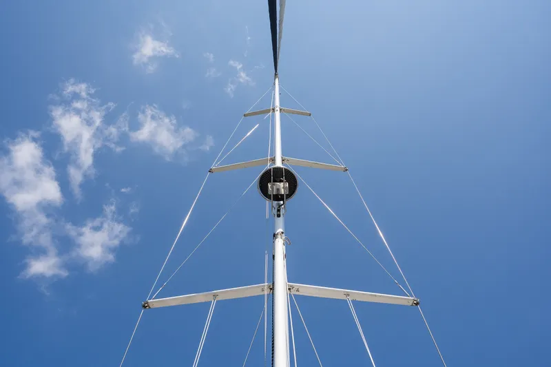 Slide: The Image of Tall sailboat mast against clear blue sky, Sabre 456, 2013 model. - 64