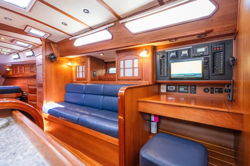 Slide: The Image of Luxurious 2013 Sabre 456 yacht interior with blue seating and advanced navigation panel. - 15