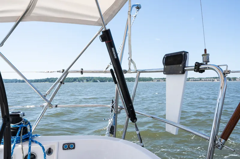 Slide: The Image of Sailing on a 2013 Sabre 456 yacht, featuring a sleek cockpit and scenic water view. - 54
