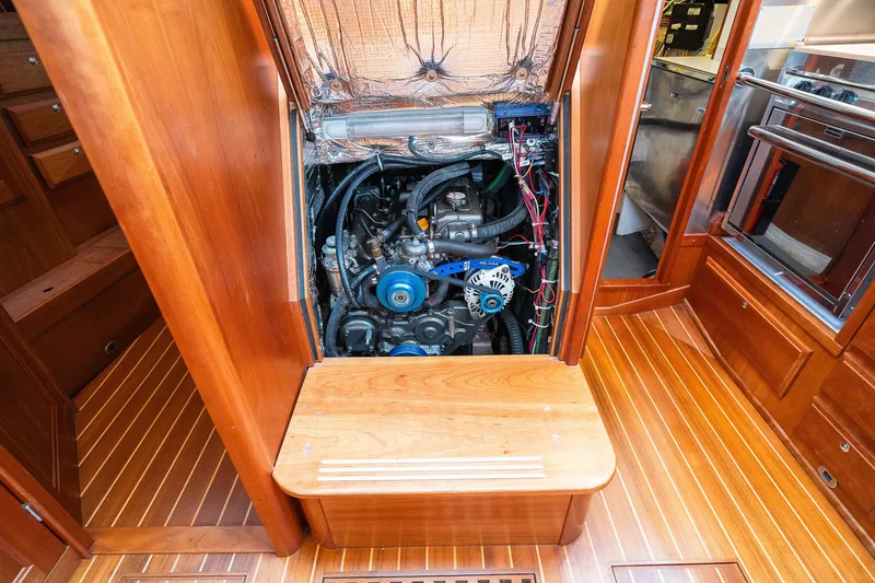 Slide: The Image of Engine compartment of a 2013 Sabre 456 yacht, showcasing detailed mechanical components. - 31