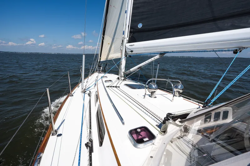 Slide: The Image of Sailing on a 2013 Sabre 456 yacht, clear skies, and calm waters. - 38