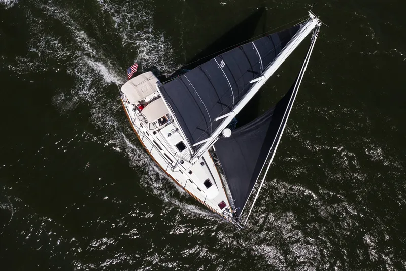 Slide: The Image of Aerial view of 2013 Sabre 456 sailboat navigating through dark waters. - 51
