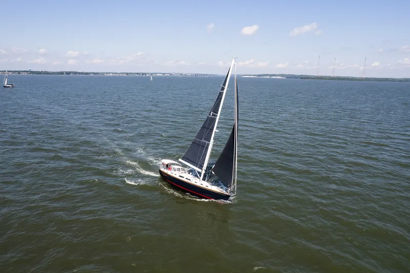 Slide: The Image of Sailboat Sabre 456 (2013) navigating open waters under clear skies. - 50