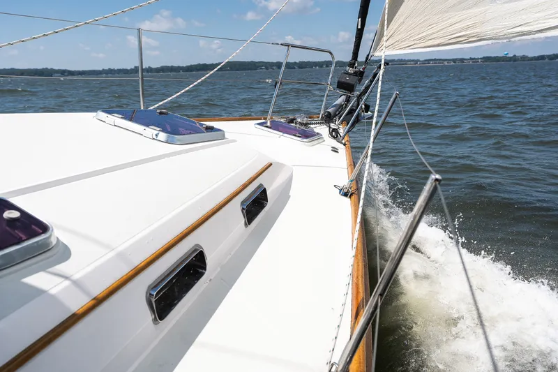 Slide: The Image of Sailing on a 2013 Sabre 456 yacht, cutting through waves on a sunny day. - 39