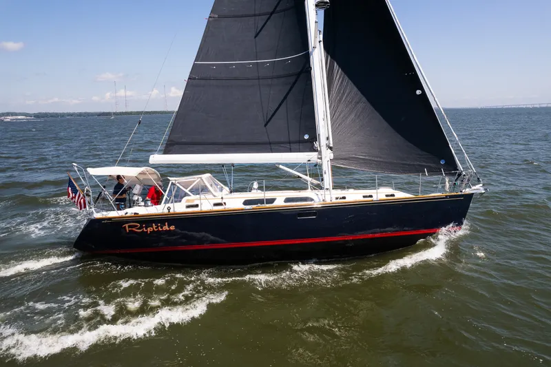 Slide: The Image of Sailing yacht "Riptide" on water, Sabre 456 model, 2013, with black sails. - 32