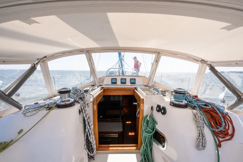Slide: The Image of 2013 Sabre 456 sailboat cockpit with ropes and winches, sailing on open water. - 59