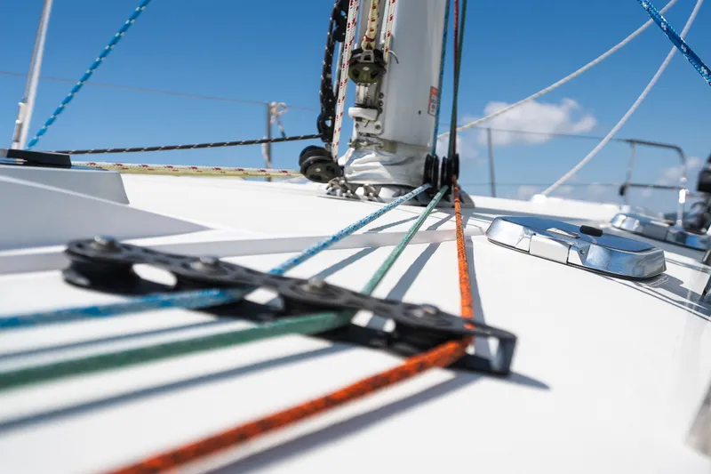 Slide: The Image of Close-up of Sabre 456 sailboat deck with colorful ropes, 2013 model, under clear blue sky. - 40