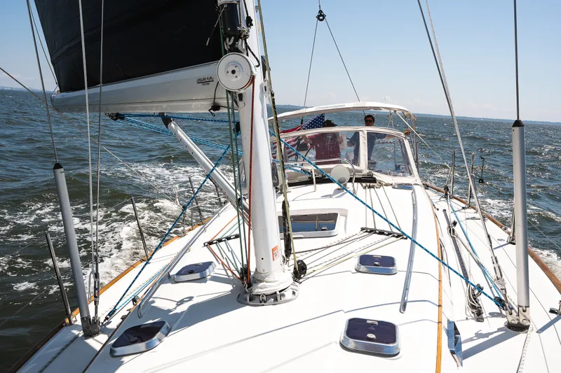 Slide: The Image of Sailing on a 2013 Sabre 456 yacht, navigating open waters under clear skies. - 35
