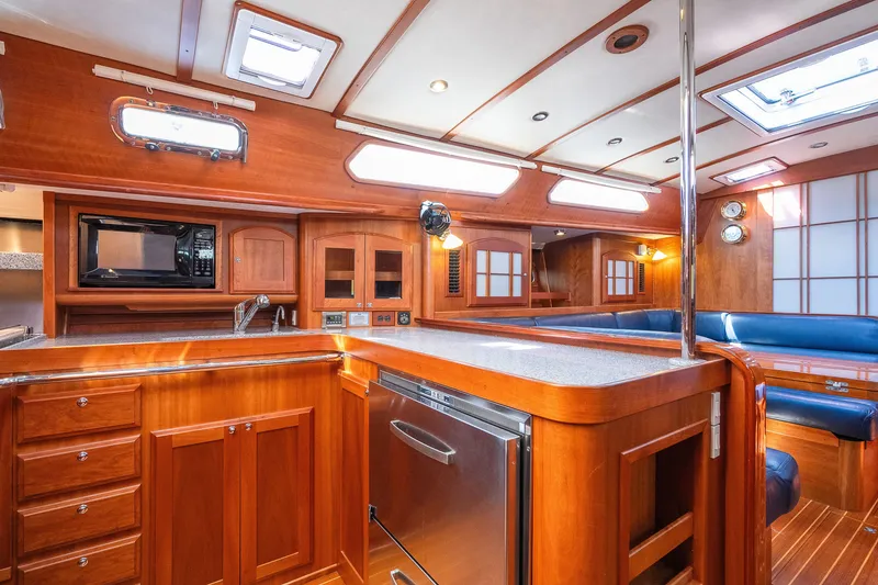 Slide: The Image of Luxurious 2013 Sabre 456 yacht interior with elegant wood finish and modern amenities. - 6