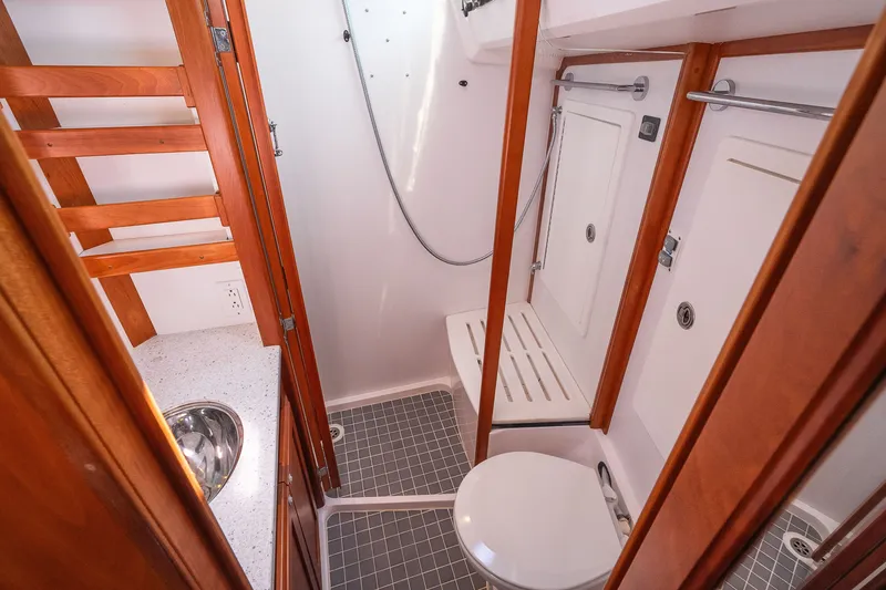 Slide: The Image of Compact bathroom in 2013 Sabre 456 yacht with wooden accents and modern fixtures. - 20