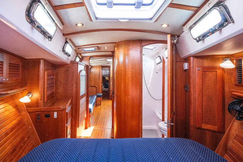 Slide: The Image of Luxurious 2013 Sabre 456 yacht interior with wooden finishes and cozy cabin lighting. - 18