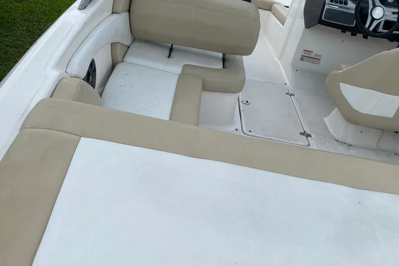 Slide: The Image of Interior of a 2017 Regal 1900 ES Bowrider boat with beige seating. - 8