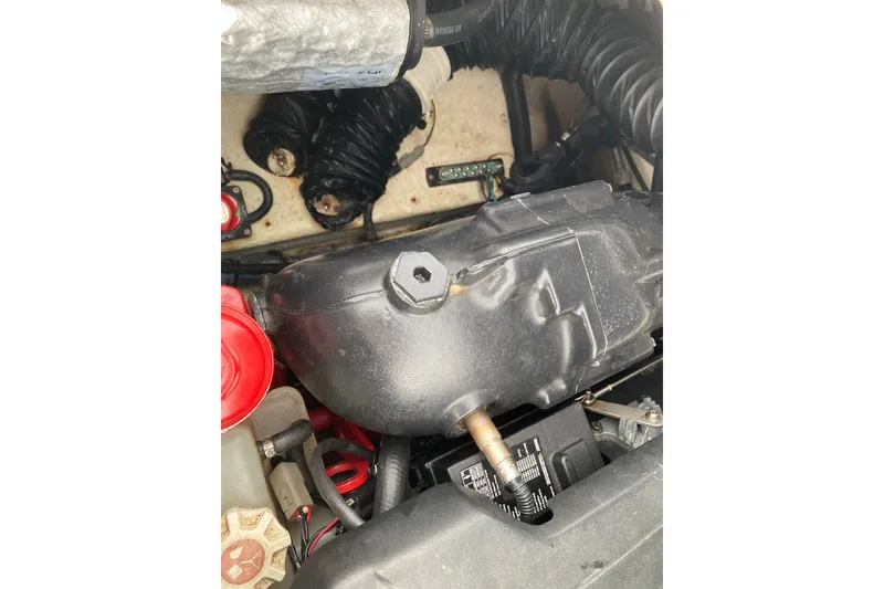 Slide: The Image of Engine compartment of a 2017 Regal 1900 ES Bowrider boat, showing various components. - 15
