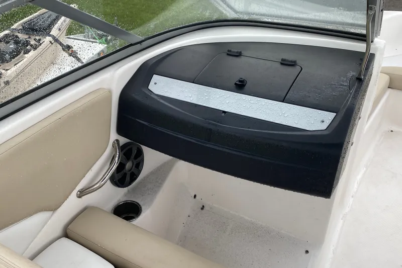 Slide: The Image of Interior of 2017 Regal 1900 ES Bowrider with wet seating and storage compartment. - 11