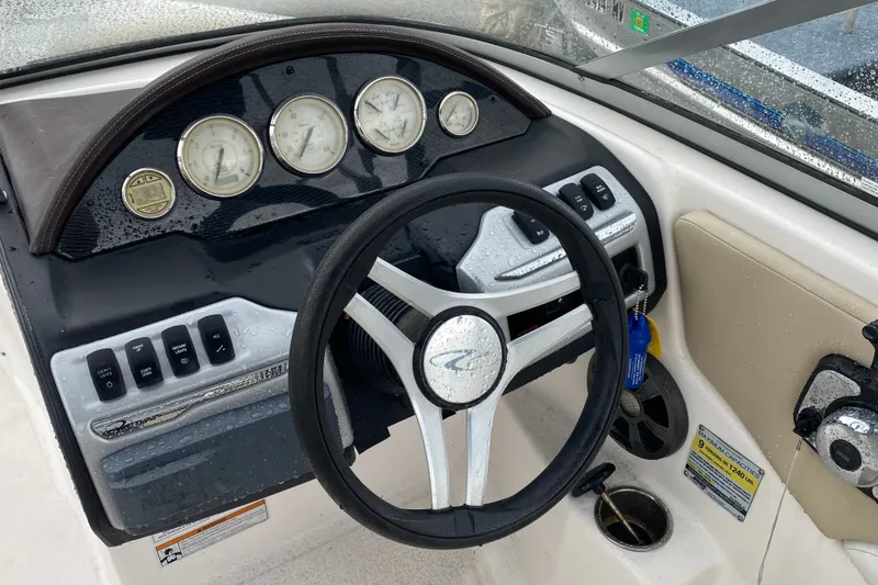 Slide: The Image of Dashboard of a 2017 Regal 1900 ES Bowrider boat with steering wheel and gauges. - 10