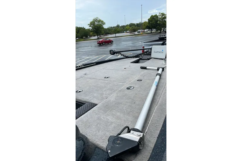 Slide: The Image of 2008 Triton Tr-196 SC boat deck with Garmin equipment in a parking lot. - 6