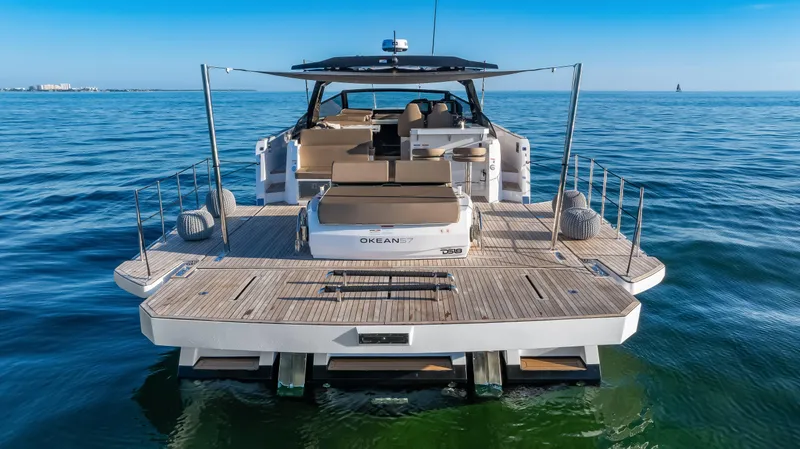 Slide: The Image of Luxury OKEAN 57 yacht, 2026 model, cruising on open sea with spacious deck. - 28