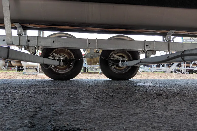 Slide: The Image of Underside view of 2022 SunCatcher Select 20F trailer wheels and suspension system. - 37