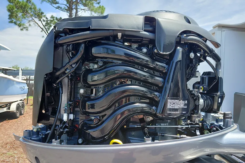 Slide: The Image of 2022 SunCatcher Select 20F outboard motor, detailed view of engine components. - 38